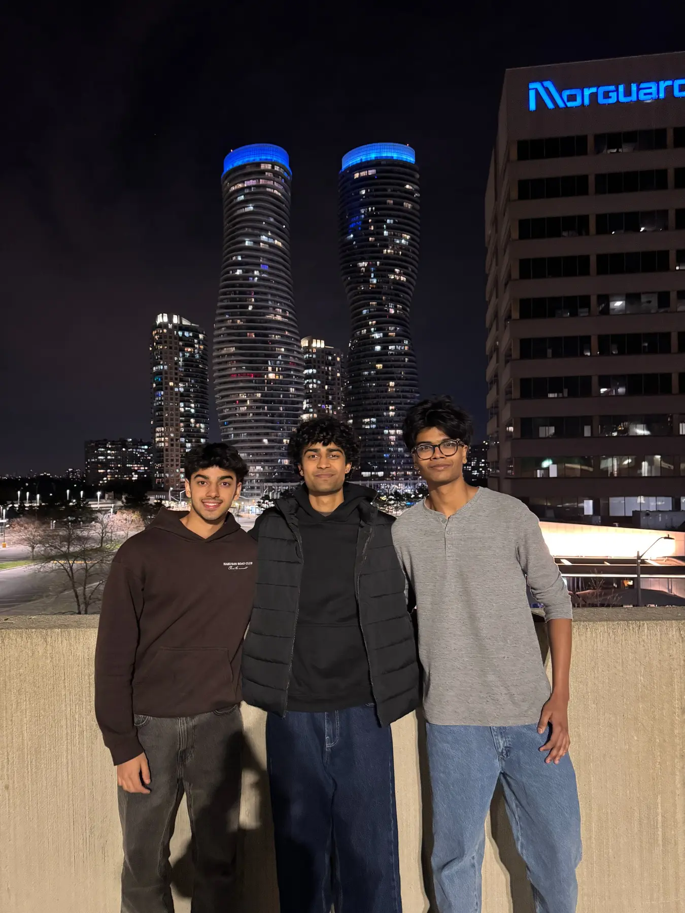 Supreeth and friends together in the city at night