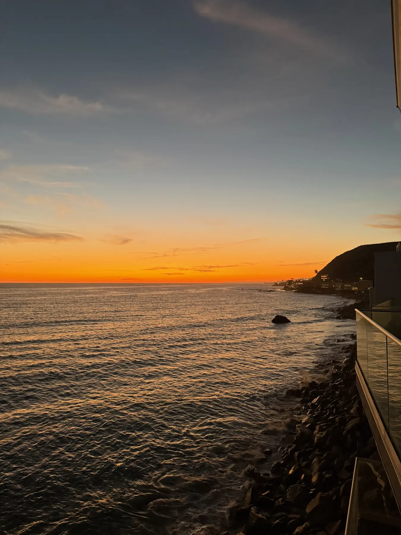 An orange sunset over the Pacific Ocean in Los Angeles